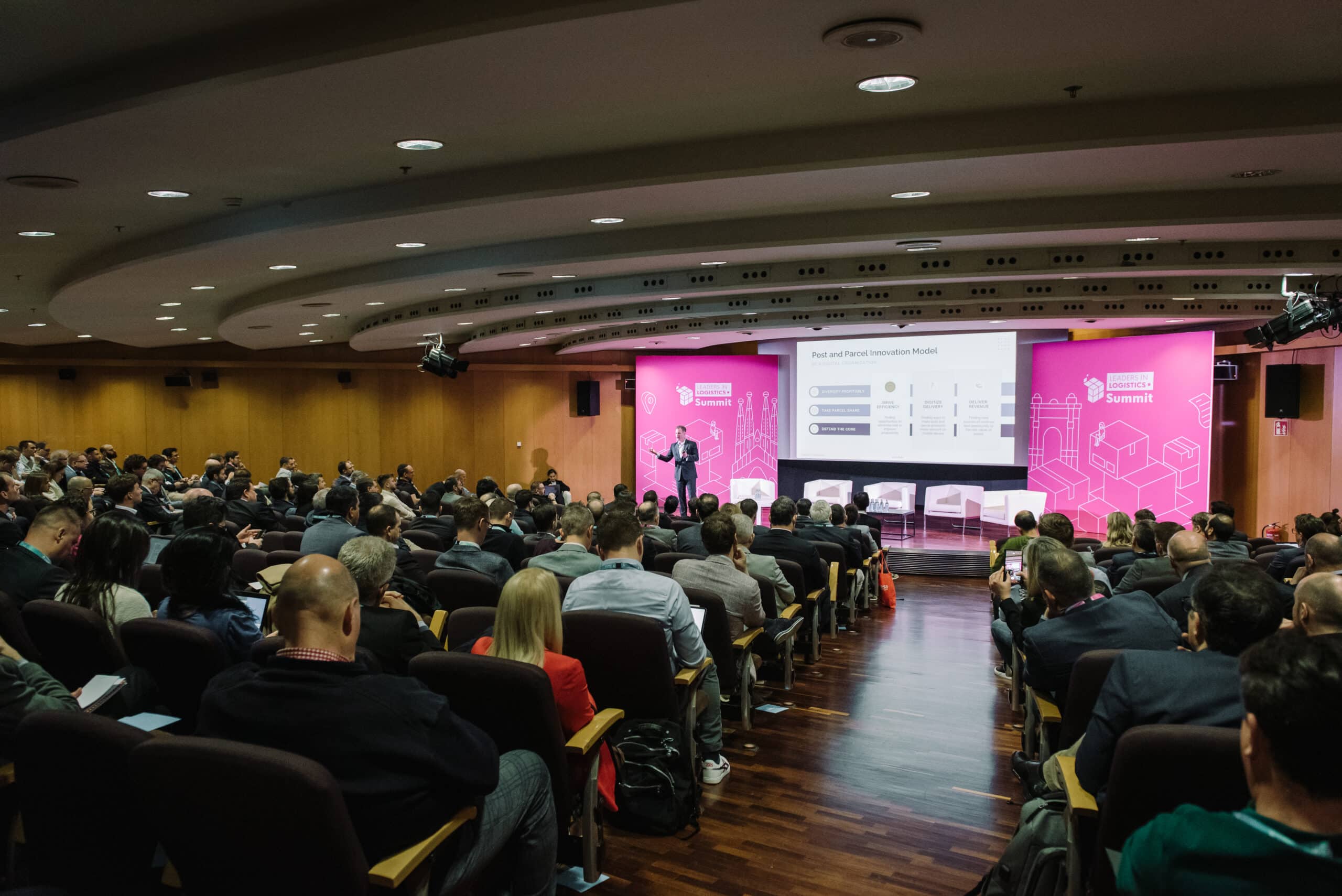 Speaker and audience at logistics conference